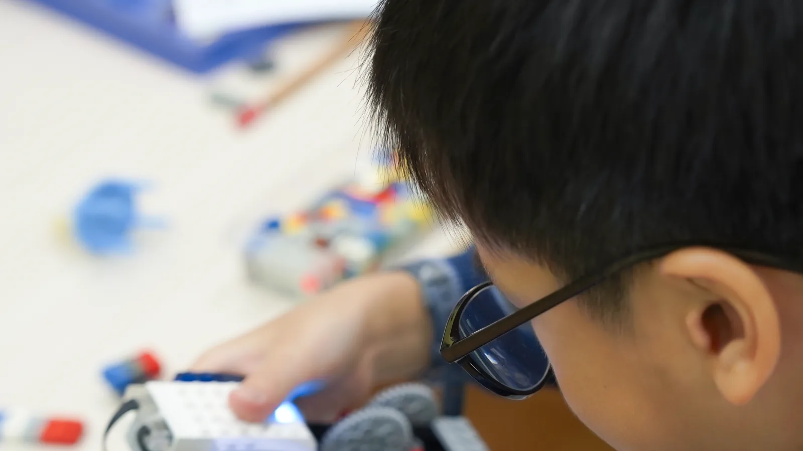 Child working on a hands-on robotics project