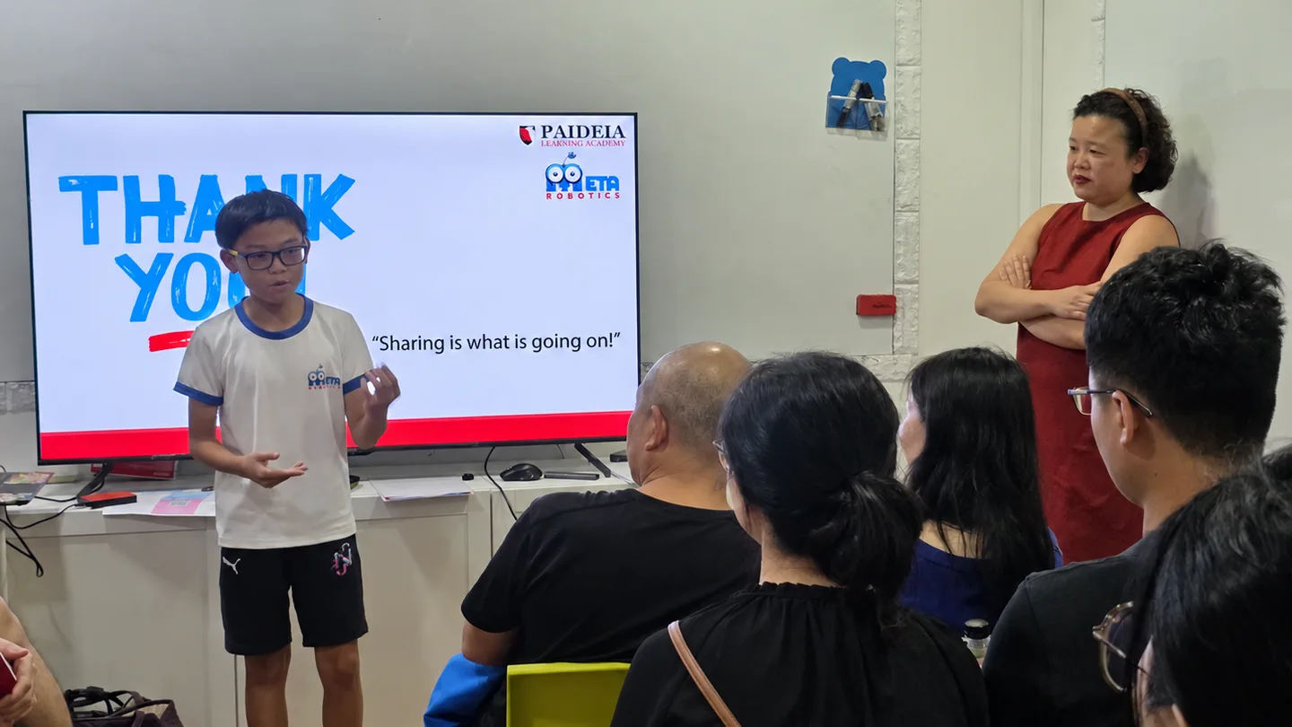 Student presenting a robotics project to an audience